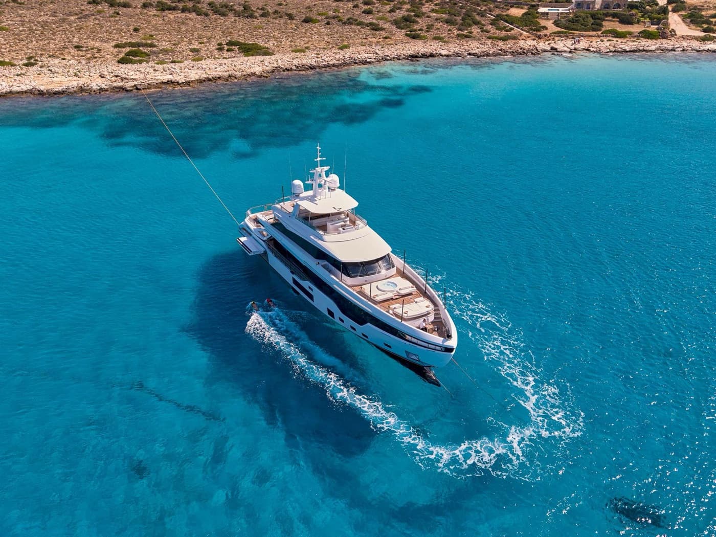 Superyacht cruising over turquoise water