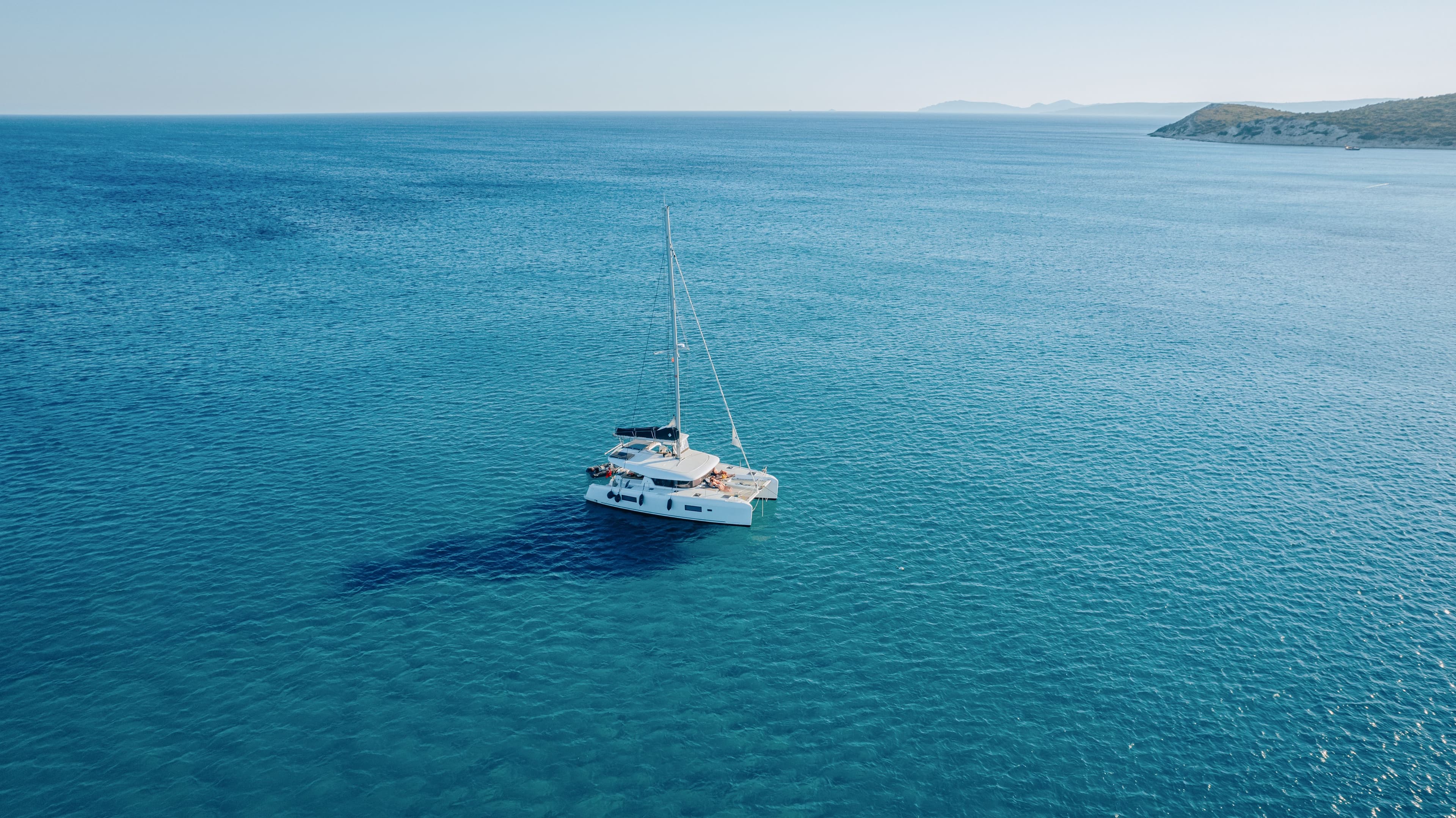 How to Charter a Crewed Catamaran in the BVI: Costs, Steps and What's Included (2026)